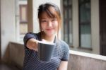 Portrait Of Thai Adult Beautiful Girl Drinking Coffee Stock Photo