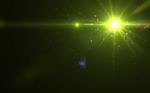 Yellow Digital Lens Flare In Black Background Horizontal Frame W Stock Photo