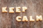 Keep Calm Alphabet Biscuit On Wooden Table Stock Photo