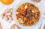 Brown Beans With Meat And Carrot Stock Photo