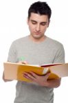 Man Studying With Dossier Stock Photo