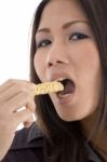 Pretty Woman Eating Cookies Stock Photo