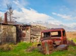 Old Car Behind A Shack Stock Photo