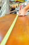 Man Working And Measuring Wood Stock Photo