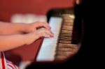 Girl Plays Piano Stock Photo