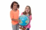 Little Girls Playing With Globe Stock Photo