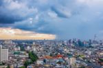 Big City With Rain Cloud Falling Stock Photo