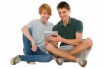 Teenage Boys Using Ipad Stock Photo