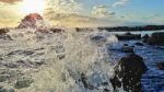 Wave Shattering On Rocks Stock Photo