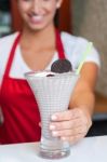 Female Chef Serving Milk Shake Stock Photo