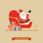 Santa Claus On A Sleigh With Piles Of Presents Stock Photo