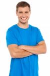 Young Man With Arms Crossed Stock Photo