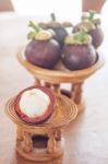 Group Of Mangoesteen On Wooden Tray Stock Photo