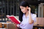 Asia Thai High School Student Uniform Beautiful Girl Read A Book Stock Photo