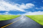 Straight Road With Grassland Stock Photo