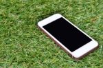 Smartphone On Grass Background Stock Photo