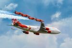 Virgin Atlantic - Boeing 747-400 And Red Arrows Aerial Display A Stock Photo