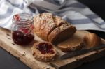 Dark Multigrain Bread Whole Grain And Jam Fresh Baked On Rustic Closeup Stock Photo