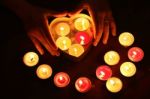 Burning Candle Heart Shape In Female Hands Stock Photo