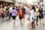 Blurred People Walking On The Street Stock Photo