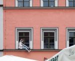 Mannequin Sitting On A Windowledge In Weimar Stock Photo