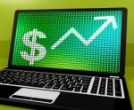 Dollar Sign And Up Arrow On Laptop For Earnings Or Profit Stock Photo