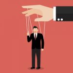 Businessman Marionette On Ropes Stock Photo