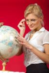 Pretty Woman Teacher With Globe Stock Photo