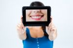 Beautiful Girl Holding A Picture Of A Mouth Smiling Stock Photo