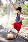 Smiling Young Boy With His Basketball Stock Photo