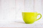 Coffee Cup On A Wooden Floor Stock Photo