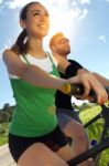 Happy Young  Couple On A Bike Ride In The Countryside Stock Photo