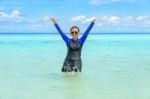 Happy Asian Teen Girl Play Splashing Water In The Sea Stock Photo