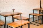 Room Interior White Brick Wall With Wooden Table Stock Photo