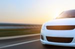 Movement Car Speed On Asphalt At Sunset Stock Photo