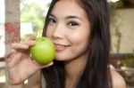 Girl Holding Green Apple Stock Photo