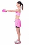 Sporty Woman Doing Her Workout With Dumbbells Stock Photo