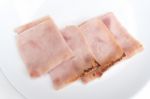 Sliced Ham On White Dish Stock Photo