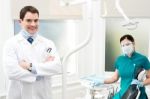 Male Dentist With Female Assistant Stock Photo