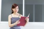 Portrait Of Thai Adult Businesswoman Beautiful Girl Read A Book Stock Photo