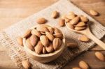 Almond In Wooden Bowl On Table Stock Photo