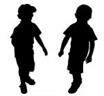 Silhouettes Of Two Little Boys Stock Photo