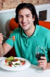 Handsome Young Guy Enjoying His Meal Stock Photo