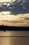 The Sunset On The Lake With Two Yachts Stock Photo