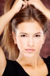 Young Woman On Dark Background Stock Photo