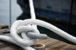 White Rope With Mooring Bollard Stock Photo