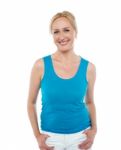 Pretty Woman In Bright Blue Sleeveless Top Stock Photo