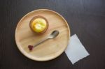 Portuguese Egg Tart On A Wood Dish With White Greeting  Blank Paper Stock Photo