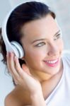 Pretty Young Woman Listening Music At Home Stock Photo