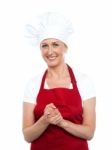 Smiling Senior Chef Standing Stock Photo